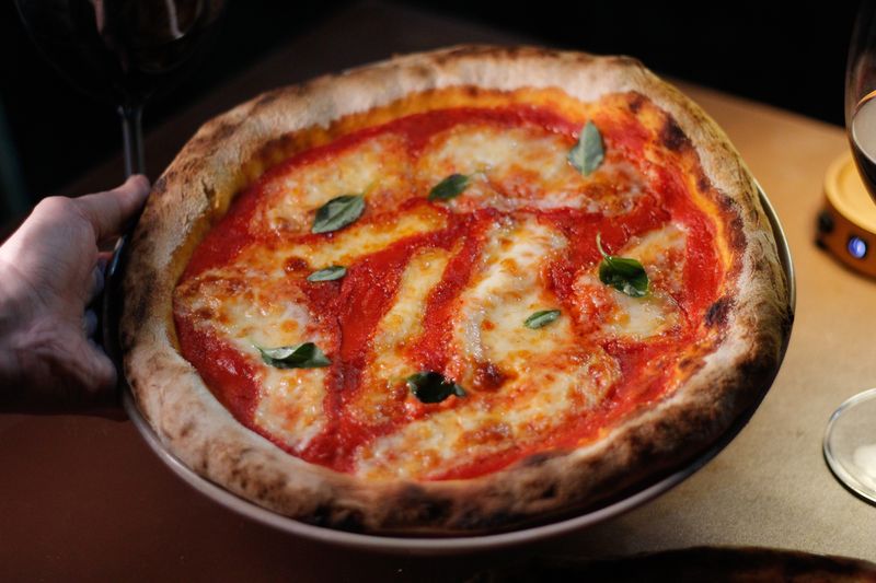 Artisan veggie pizza with colorful fresh vegetables